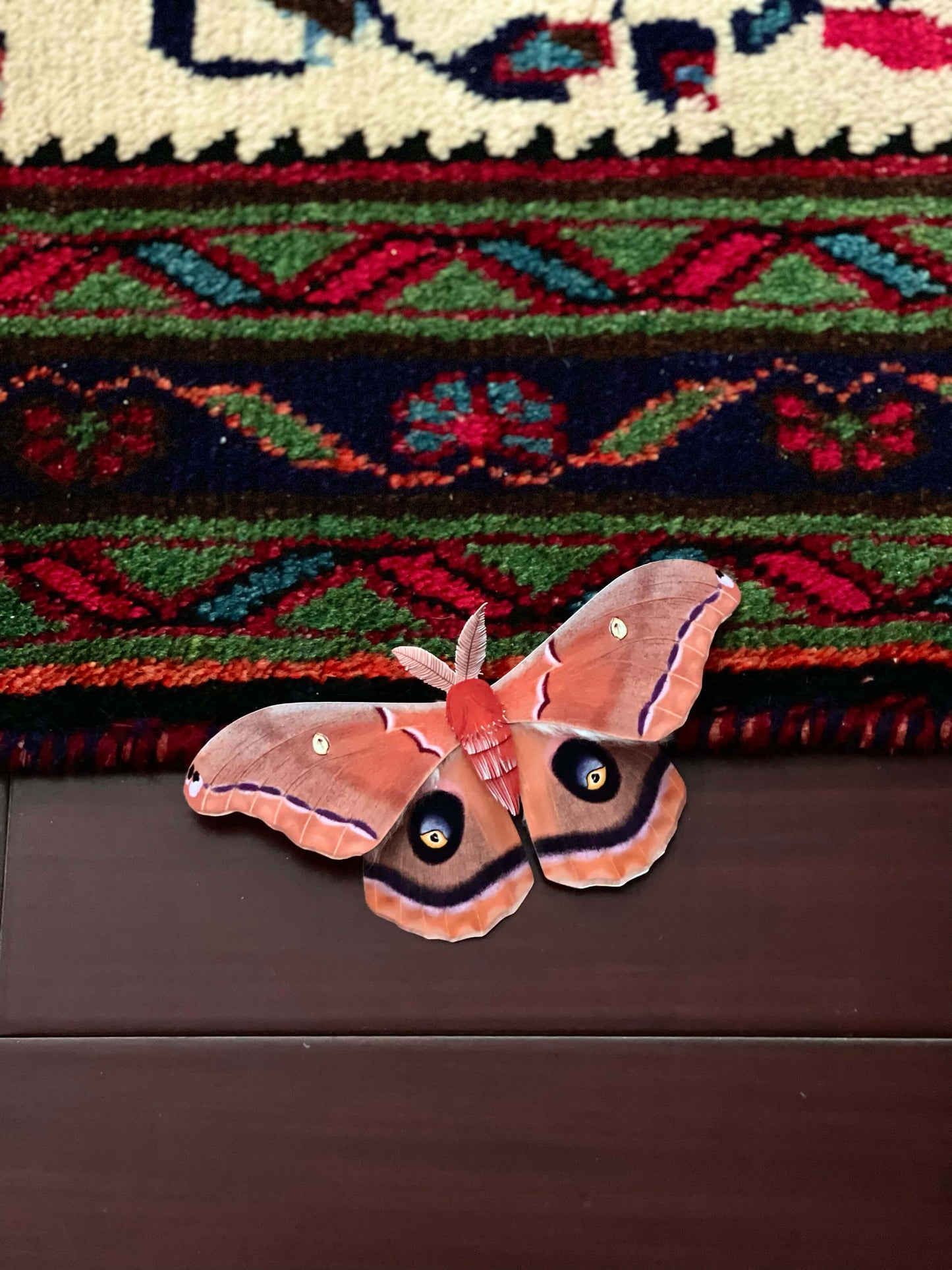 Decorative DIY Paper Polyphemus Moth on floor