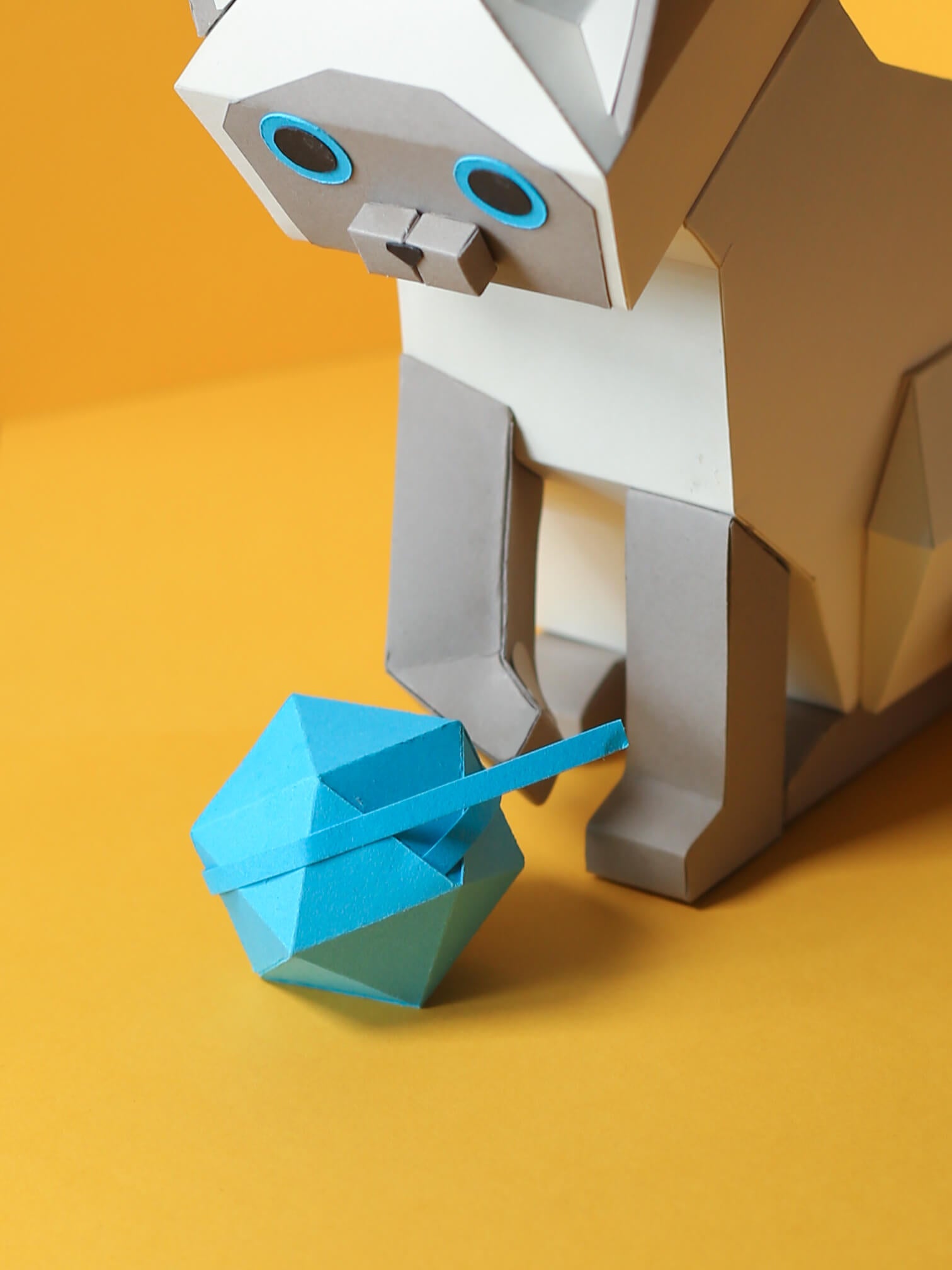 papercraft siamese cat playing with a blue yarn ball, an adorable DIY gift or for home decor, made from Digital Template