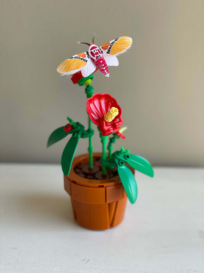 Paper Moth, Paper Clown Face Moth staying on a lego plant
