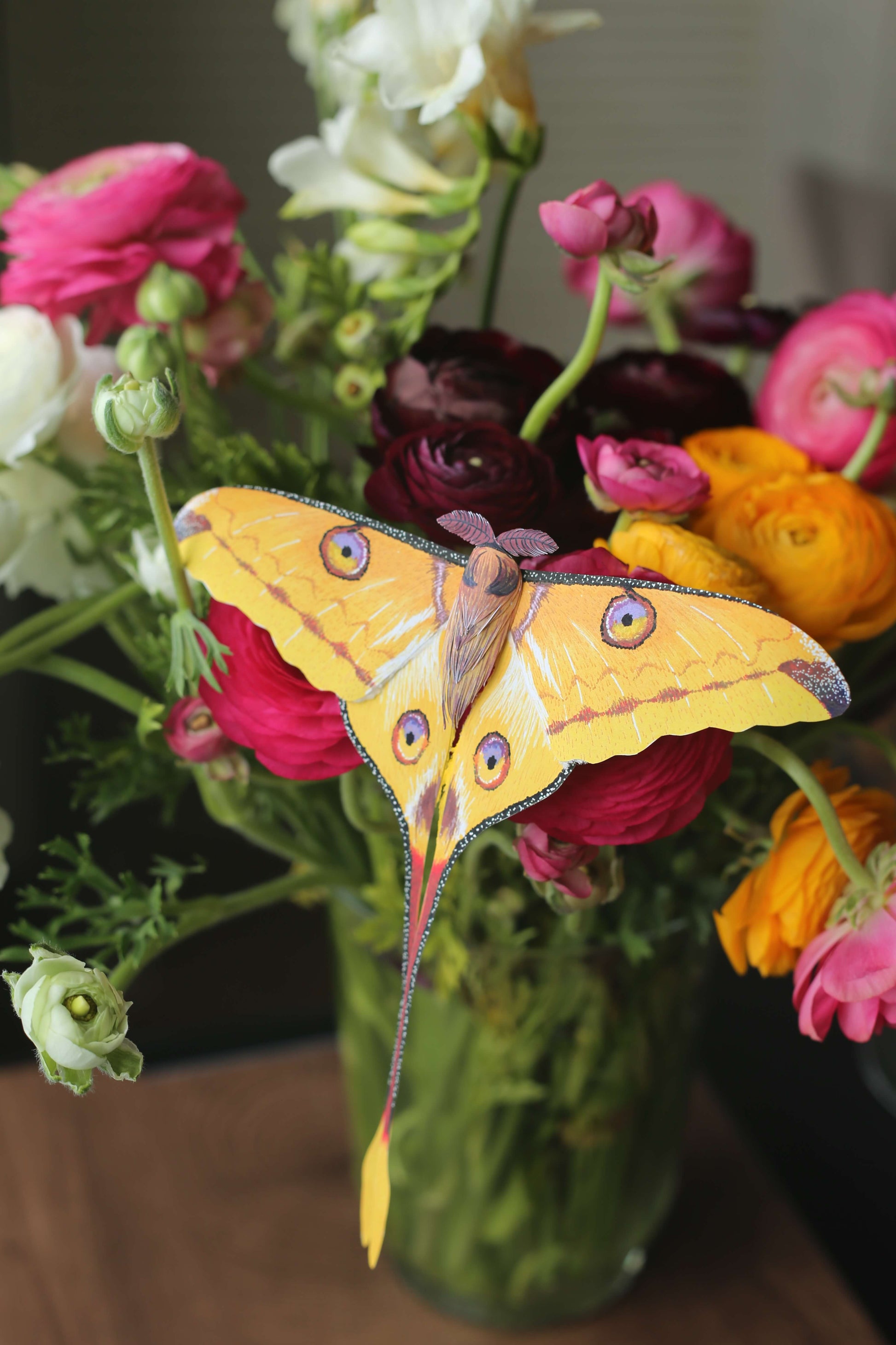 Realistic paper comet moth/ Madagascan moon moth on flowers